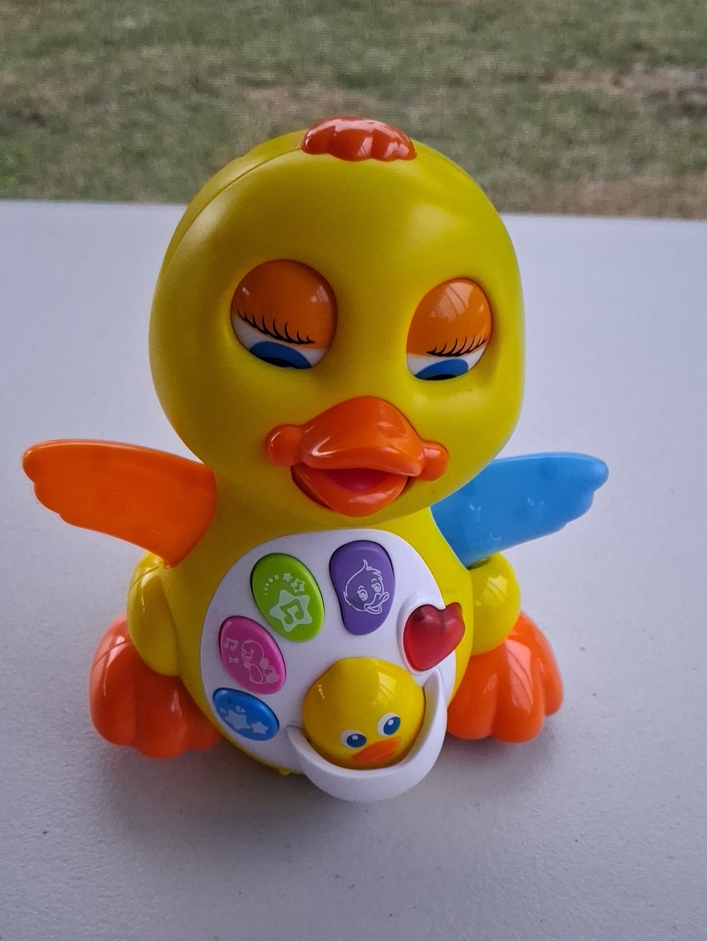 Yellow Musical Duck Toy with Orange and Blue Accents